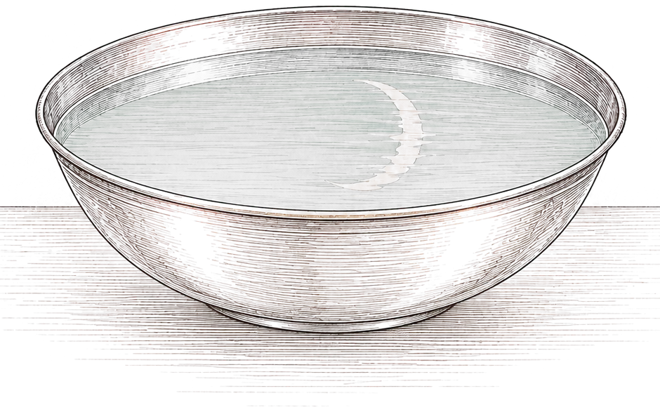 A shallow silver bowl of water with a thin crescent reflected in it